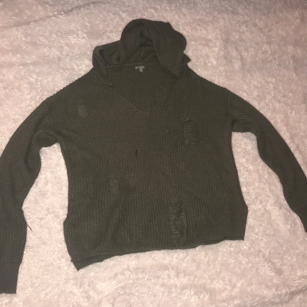 Green sweater with holes